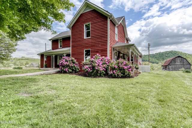 26354 Pewter Ln, Abingdon, VA 24211 - view of property exterior featuring a barn, a yard, a porch, and an outbuilding