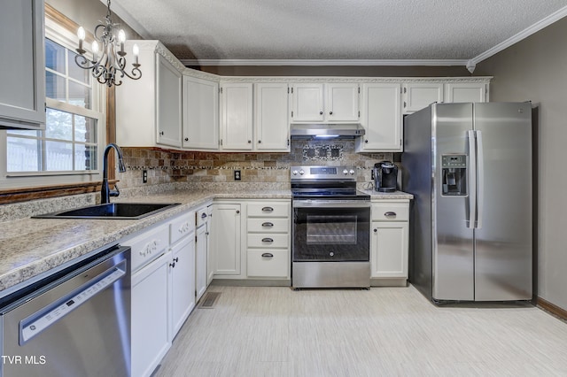 719 W Valley Dr, Kingsport, TN 37664 - kitchen featuring stainless steel appliances, a sink, under cabinet range hood, ornamental molding, and light countertops