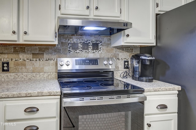 719 W Valley Dr, Kingsport, TN 37664 - kitchen featuring stainless steel appliances, range hood, backsplash, white cabinets, and light stone counters