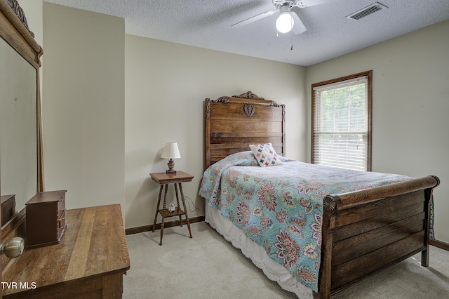 719 W Valley Dr, Kingsport, TN 37664 - carpeted bedroom featuring baseboards, a textured ceiling, and ceiling fan