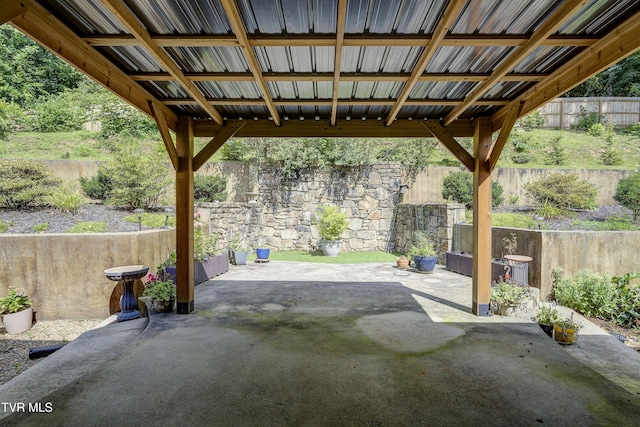 fenced backyard with a patio area