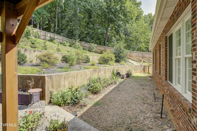 fenced backyard with a patio