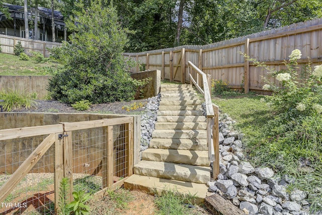fenced backyard with stairway