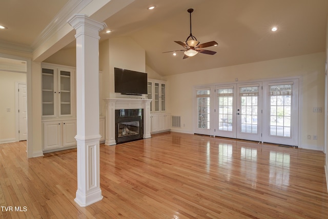 unfurnished living room with decorative columns, a ceiling fan, light wood finished floors, a glass covered fireplace, and recessed lighting