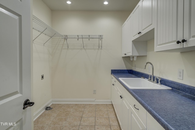 washroom featuring recessed lighting, electric dryer hookup, and light tile patterned flooring