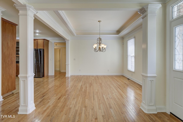 unfurnished dining area featuring light wood-style flooring, a chandelier, and crown molding