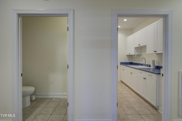bathroom featuring tile patterned floors, vanity, and recessed lighting
