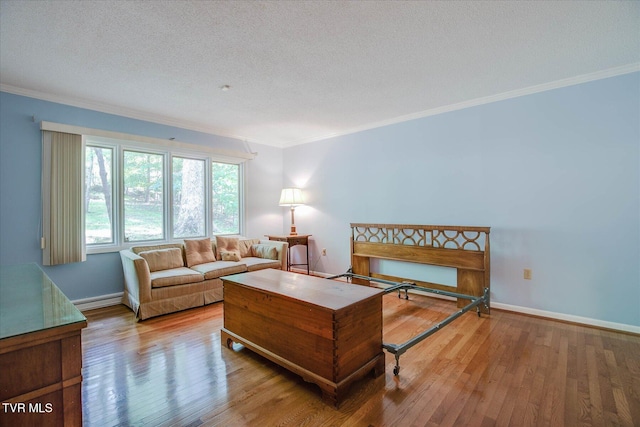 4401 Beechcliff Dr, Kingsport, TN 37664 - living room featuring wood finished floors, ornamental molding, baseboards, a baseboard heating unit, and a textured ceiling