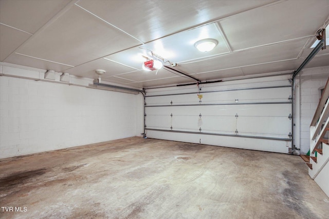 4401 Beechcliff Dr, Kingsport, TN 37664 - garage with a garage door opener and concrete block wall