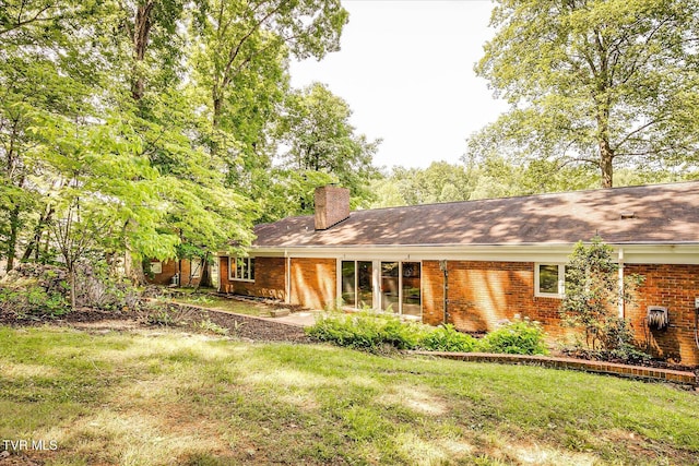 4401 Beechcliff Dr, Kingsport, TN 37664 - single story home with a chimney, brick siding, a front lawn, and roof with shingles