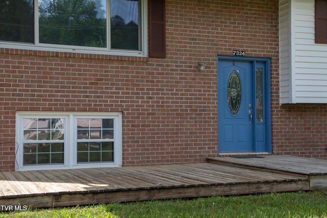 7324 White Pine Cir, Bristol, VA 24202 - view of exterior entry with brick siding and a wooden deck
