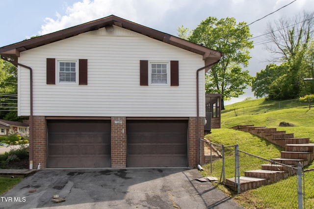 7324 White Pine Cir, Bristol, VA 24202 - view of front of home with brick siding, a garage, driveway, and stairway