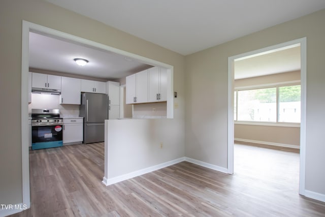 7324 White Pine Cir, Bristol, VA 24202 - kitchen featuring stainless steel appliances, light wood finished floors, white cabinetry, under cabinet range hood, and baseboards