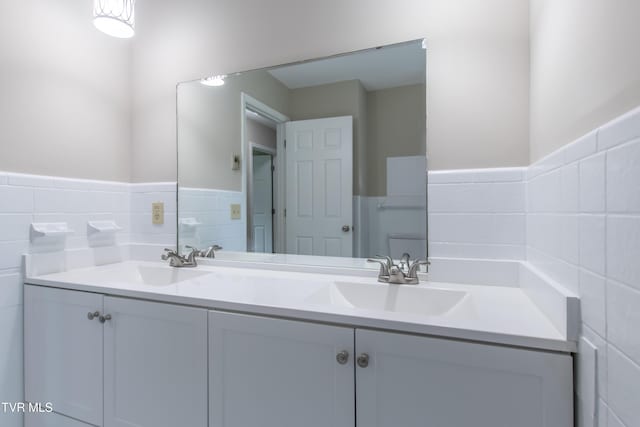 7324 White Pine Cir, Bristol, VA 24202 - bathroom featuring tile walls, double vanity, and wainscoting