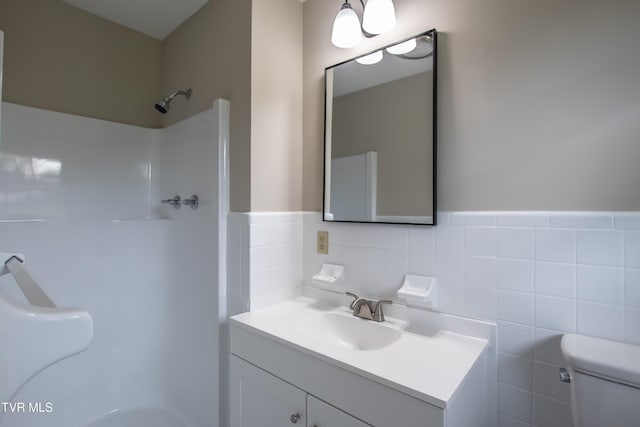 7324 White Pine Cir, Bristol, VA 24202 - full bathroom featuring toilet, vanity, tile walls, and a wainscoted wall
