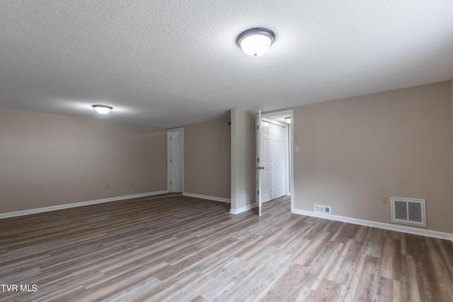 7324 White Pine Cir, Bristol, VA 24202 - finished below grade area with wood finished floors, a textured ceiling, and baseboards