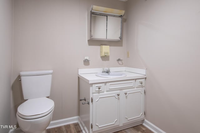 7324 White Pine Cir, Bristol, VA 24202 - bathroom with toilet, wood finished floors, vanity, and baseboards