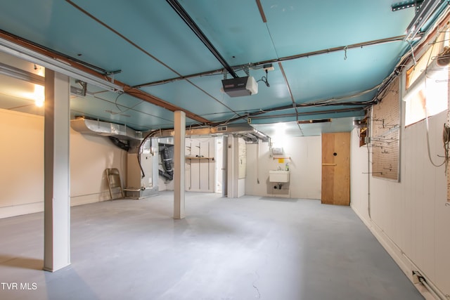 7324 White Pine Cir, Bristol, VA 24202 - below grade area featuring a sink and heating unit