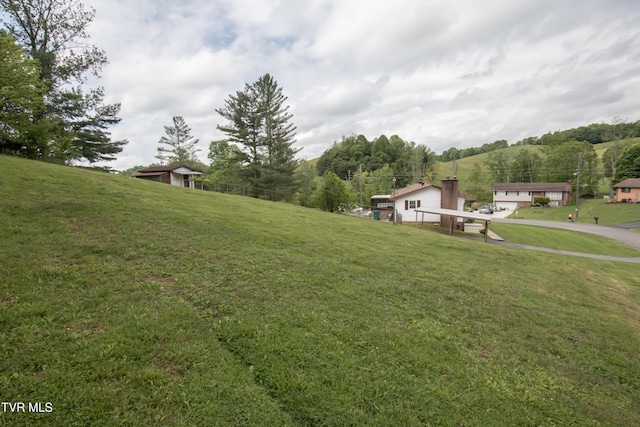 7324 White Pine Cir, Bristol, VA 24202 - view of green lawn with asphalt driveway