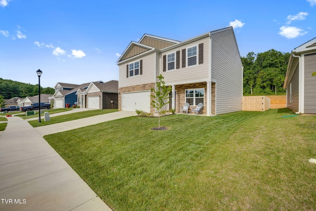 2340 Hamshire St, Johnson City, TN 37601 - view of front of house featuring concrete driveway, board and batten siding, stone siding, and a front lawn