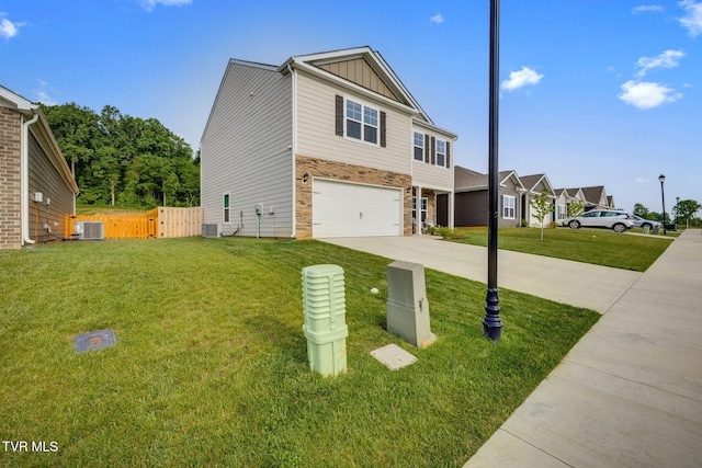 2340 Hamshire St, Johnson City, TN 37601 - view of front facade featuring board and batten siding, central air condition unit, a garage, stone siding, and concrete driveway