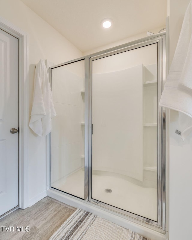 2340 Hamshire St, Johnson City, TN 37601 - full bathroom featuring a shower stall and wood finished floors