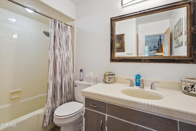 full bath with toilet, vanity, and shower / bath combo