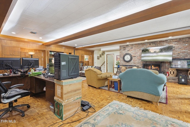 home office featuring a fireplace, wood walls, recessed lighting, and brick wall
