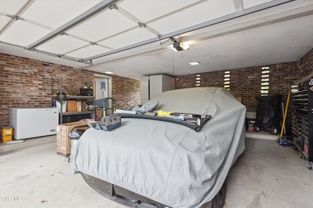 garage featuring refrigerator and a garage door opener