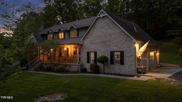 588 Spring Valley Rd, Bristol, VA 24201 - craftsman-style house with a porch, driveway, a yard, an attached garage, and stone siding