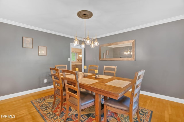 588 Spring Valley Rd, Bristol, VA 24201 - dining area with light wood-type flooring, baseboards, and ornamental molding