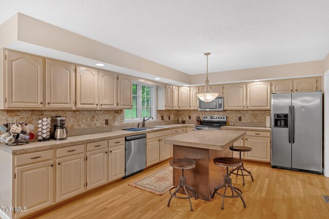 588 Spring Valley Rd, Bristol, VA 24201 - kitchen featuring stainless steel appliances, light countertops, light wood finished floors, decorative backsplash, and recessed lighting