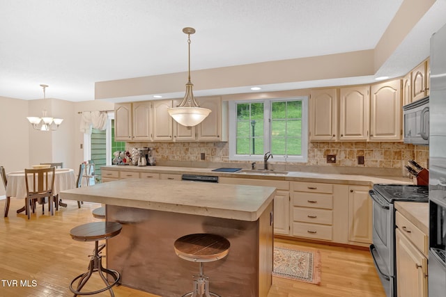 588 Spring Valley Rd, Bristol, VA 24201 - kitchen featuring a sink, stainless steel appliances, light countertops, light wood-type flooring, and a chandelier