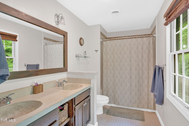 588 Spring Valley Rd, Bristol, VA 24201 - full bathroom featuring double vanity, toilet, a shower with curtain, tile patterned floors, and baseboards