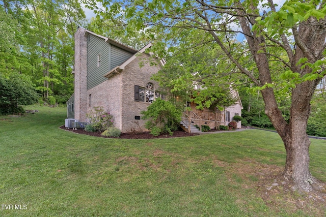 588 Spring Valley Rd, Bristol, VA 24201 - view of side of property with a chimney, a lawn, brick siding, and crawl space