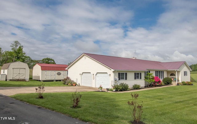 120 Greendale Ct, Elizabethton, TN 37643 - ranch-style house with a storage shed, concrete driveway, an attached garage, a front lawn, and an outdoor structure