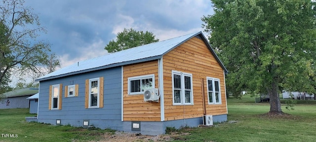 7780 Roy Rogers Dr, Whitesburg, TN 37891 - view of side of property with crawl space, ac unit, a yard, and metal roof
