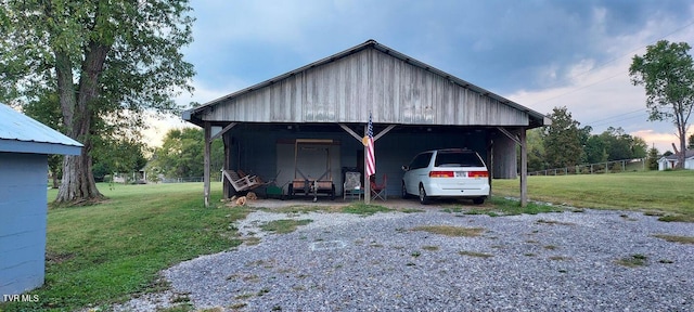 7780 Roy Rogers Dr, Whitesburg, TN 37891 - garage with gravel driveway and a detached carport