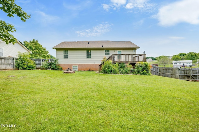 back of property with a deck