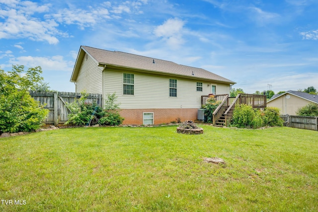 rear view of property with a fire pit, a deck, stairs, and central air condition unit