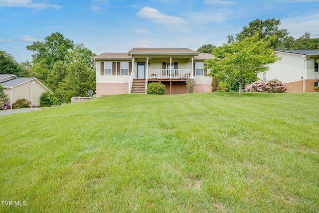 view of front of home featuring a front yard, stairs, and covered porch
