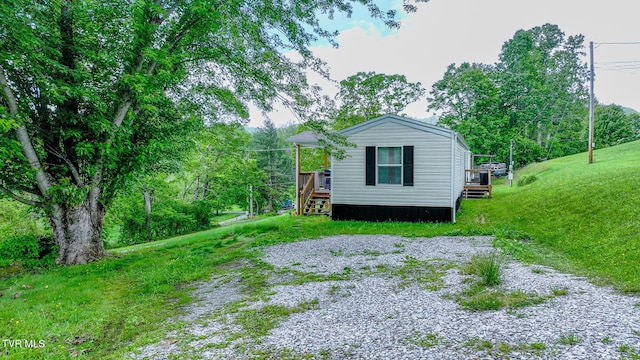 view of side of home featuring a wooden deck