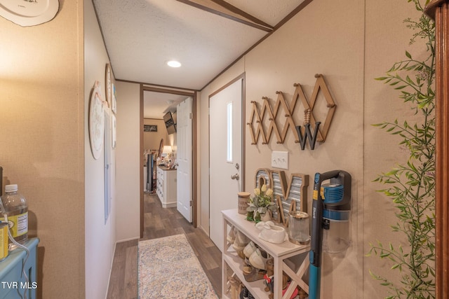 hallway with wood finished floors and recessed lighting