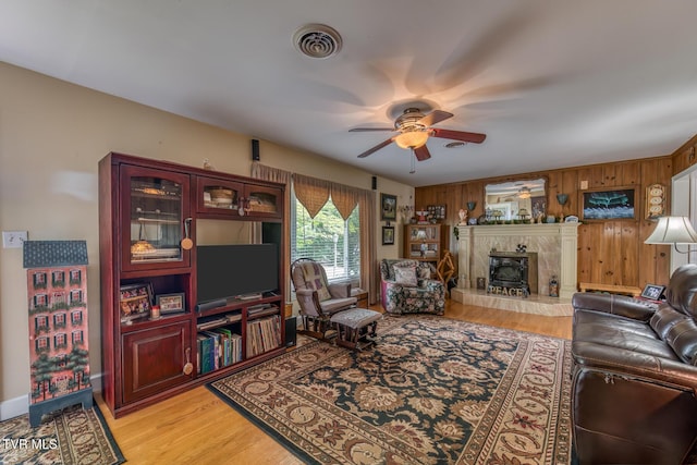 629 Buffalo Rd, Blountville, TN 37617 - living room with a ceiling fan, light wood finished floors, and wood walls