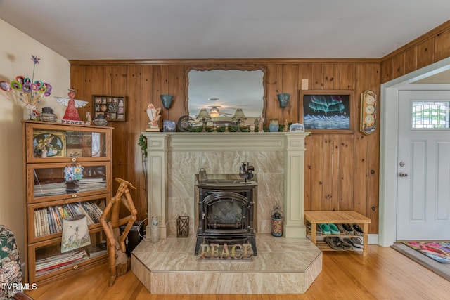 629 Buffalo Rd, Blountville, TN 37617 - sitting room featuring wood finished floors, a wood stove, and wood walls
