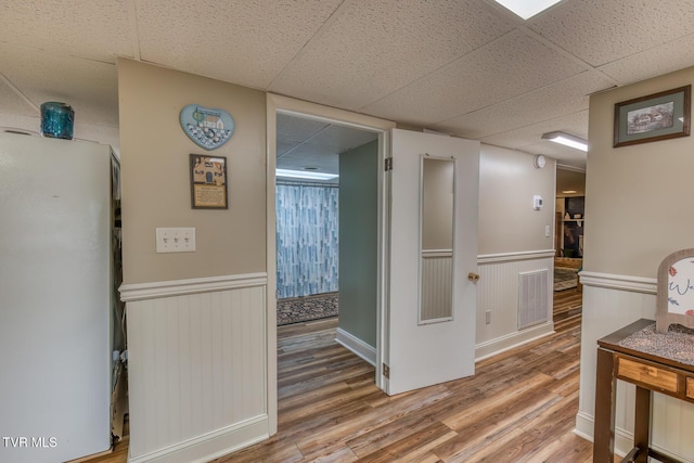 629 Buffalo Rd, Blountville, TN 37617 - hall featuring a drop ceiling, a wainscoted wall, and wood finished floors