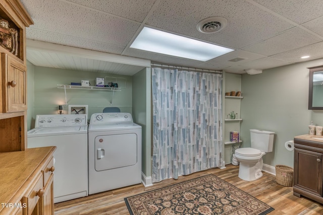 629 Buffalo Rd, Blountville, TN 37617 - washroom featuring separate washer and dryer, light wood-style flooring, and baseboards