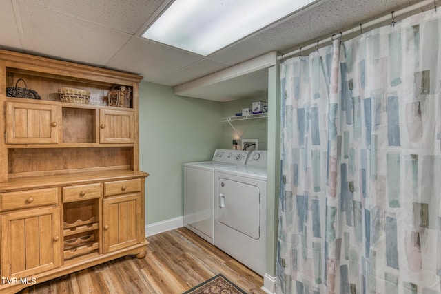 629 Buffalo Rd, Blountville, TN 37617 - laundry room with washer and clothes dryer, light wood finished floors, and baseboards