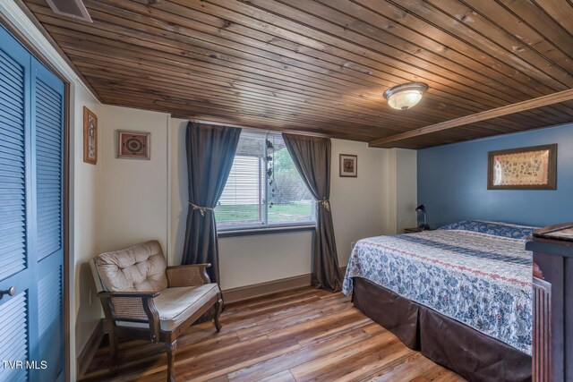 629 Buffalo Rd, Blountville, TN 37617 - bedroom featuring wood ceiling, wood finished floors, and baseboards
