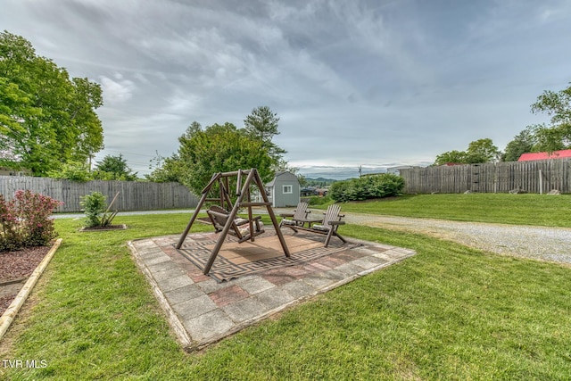 629 Buffalo Rd, Blountville, TN 37617 - view of play area with a shed, an outdoor structure, and a patio